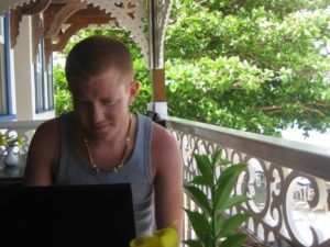 Roy working remotely in his laptop in Bequia, St. Vincent and the Grenadines